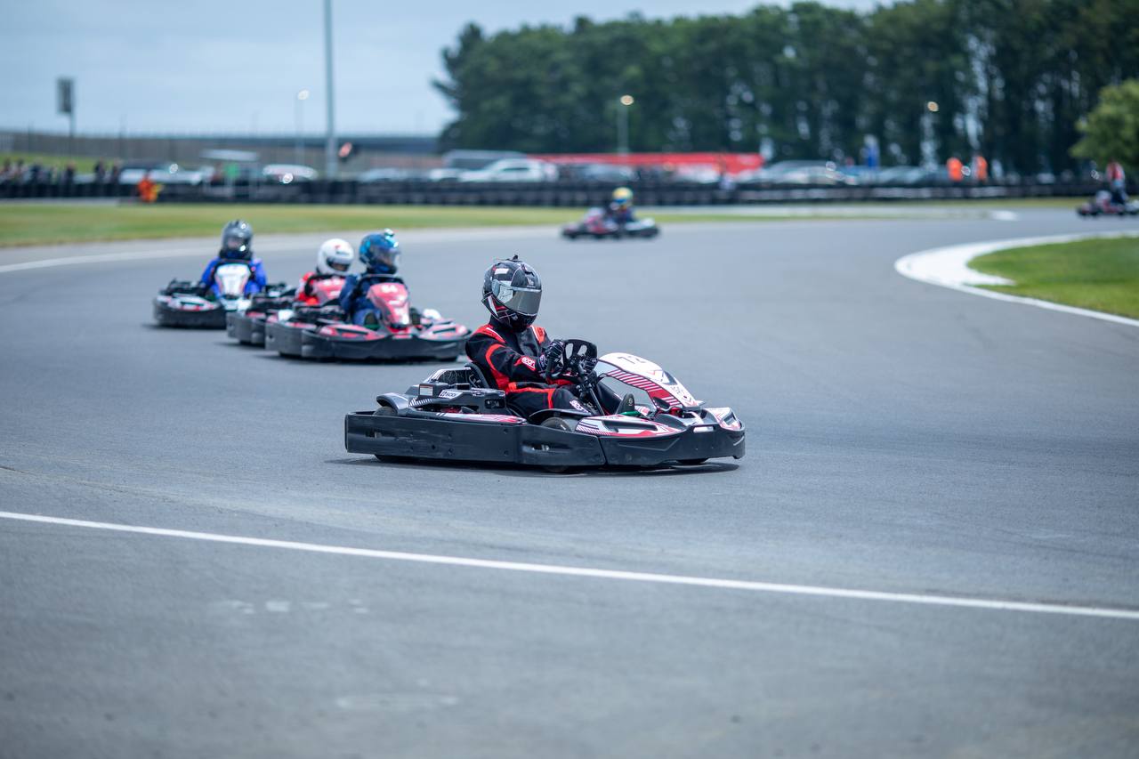 Kseniia driving a kart